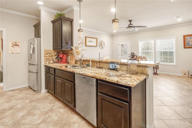 kitchen with fridge, sink, stainless steel dishwasher, and dark brown cabinetry