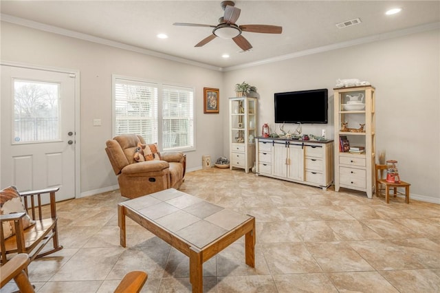 living room featuring crown molding, light tile patterned floors, and ceiling fan