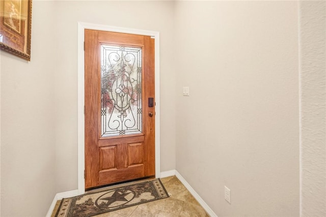 entryway with light tile patterned flooring