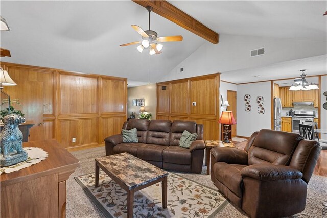 living room featuring ceiling fan, visible vents, beam ceiling, and light colored carpet