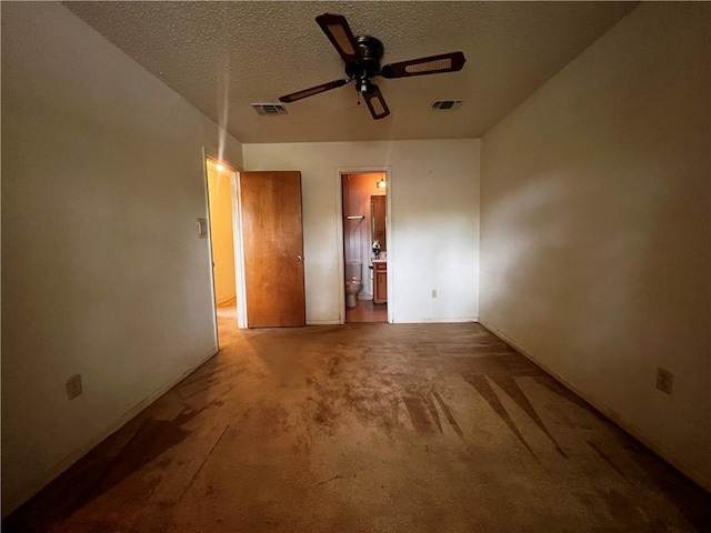 interior space featuring a textured ceiling and ceiling fan