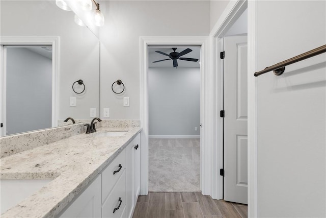 2906 Spector Dr, Bryan, TX 77808 - full bathroom featuring double vanity, a sink, ceiling fan, and wood finished floors