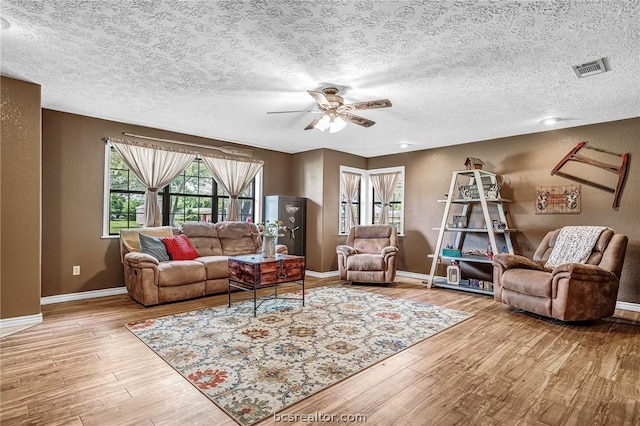 living room featuring light hardwood / wood-style floors and a healthy amount of sunlight