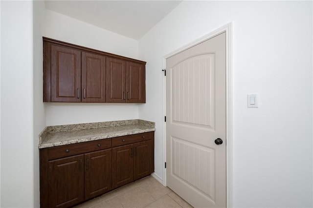 interior space with light tile patterned floors