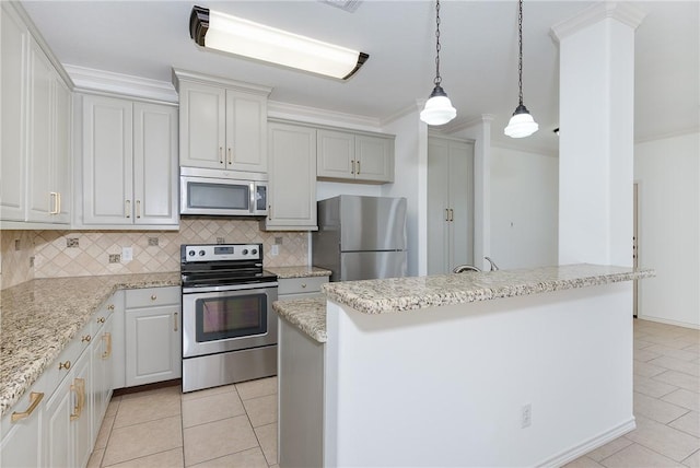 kitchen with ornamental molding, decorative light fixtures, tasteful backsplash, stainless steel appliances, and light tile patterned floors