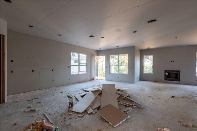 unfurnished living room featuring a fireplace