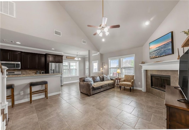 2609 Kimbolton Dr, College Station, TX 77845 - living room featuring ceiling fan, lofted ceiling, a fireplace, recessed lighting, and baseboards
