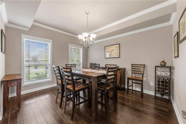 2609 Kimbolton Dr, College Station, TX 77845 - dining area with dark wood-style flooring, baseboards, a chandelier, and ornamental molding
