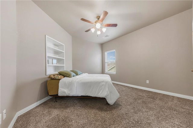 2609 Kimbolton Dr, College Station, TX 77845 - carpeted bedroom with baseboards and a ceiling fan