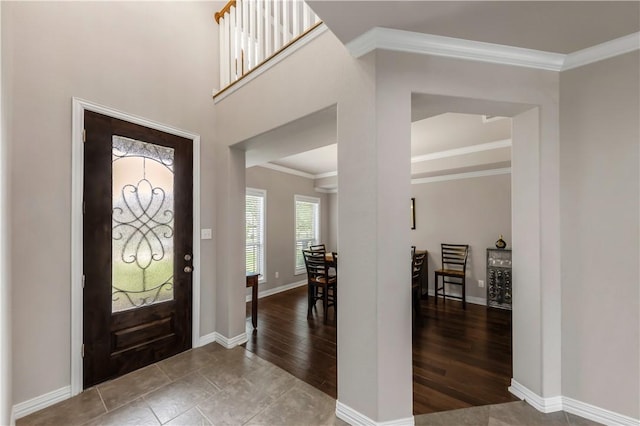 2609 Kimbolton Dr, College Station, TX 77845 - foyer with baseboards, wood finished floors, and crown molding