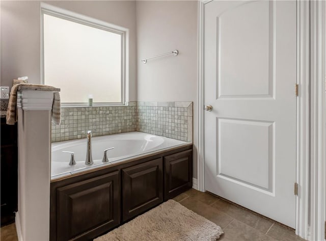 2609 Kimbolton Dr, College Station, TX 77845 - bathroom featuring a bath and tile patterned flooring