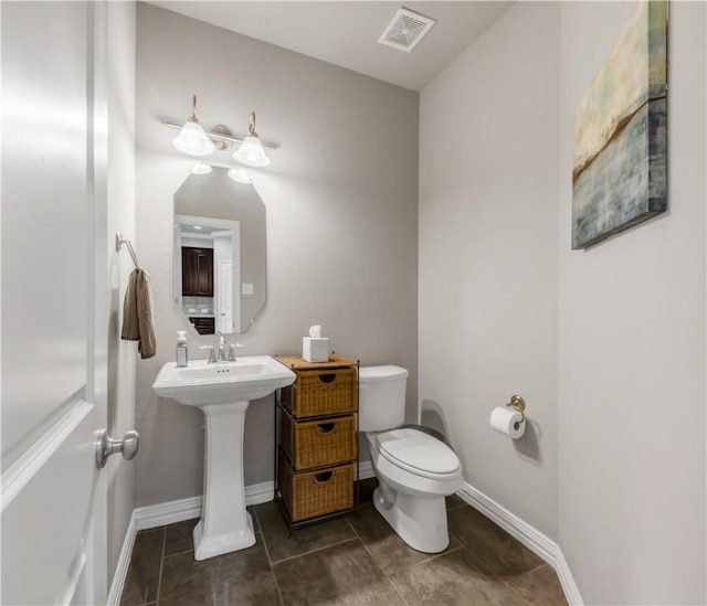 2609 Kimbolton Dr, College Station, TX 77845 - bathroom featuring toilet, tile patterned flooring, baseboards, and a sink