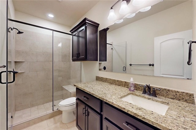 full bathroom featuring tile patterned flooring, toilet, recessed lighting, vanity, and a shower stall