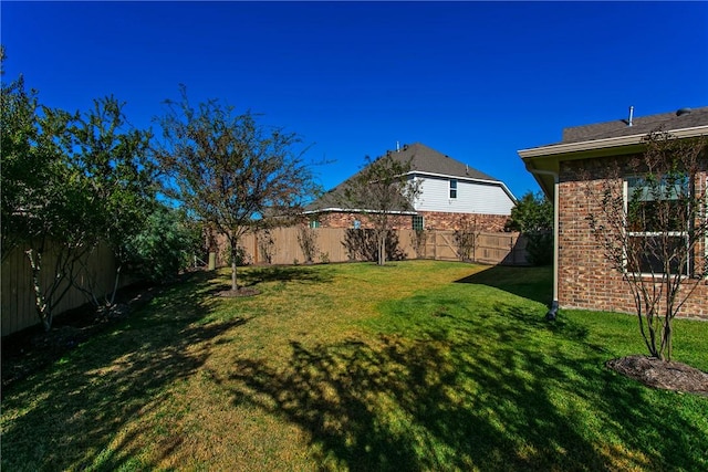 view of yard featuring a fenced backyard