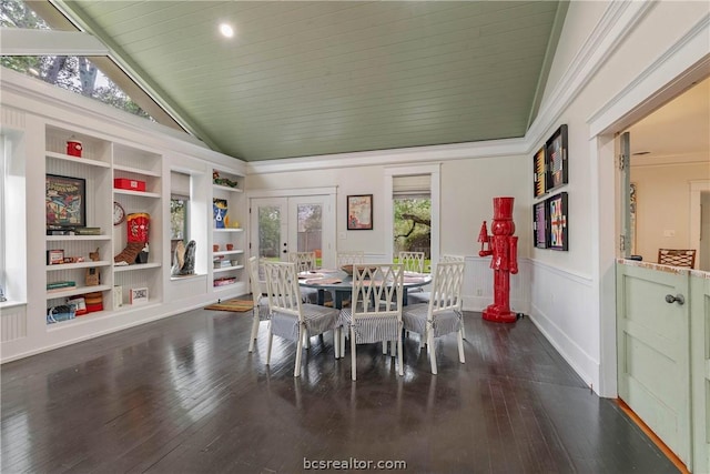 dining space with dark hardwood / wood-style floors, built in shelves, high vaulted ceiling, and french doors