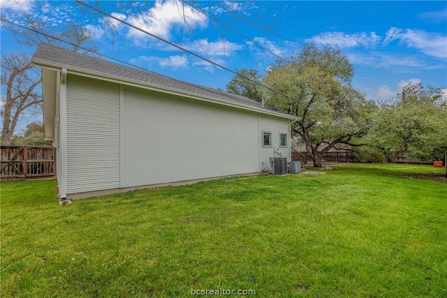 view of property exterior featuring cooling unit and a yard