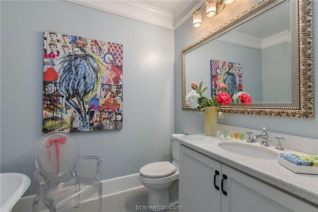 bathroom with tile patterned floors, toilet, vanity, and ornamental molding