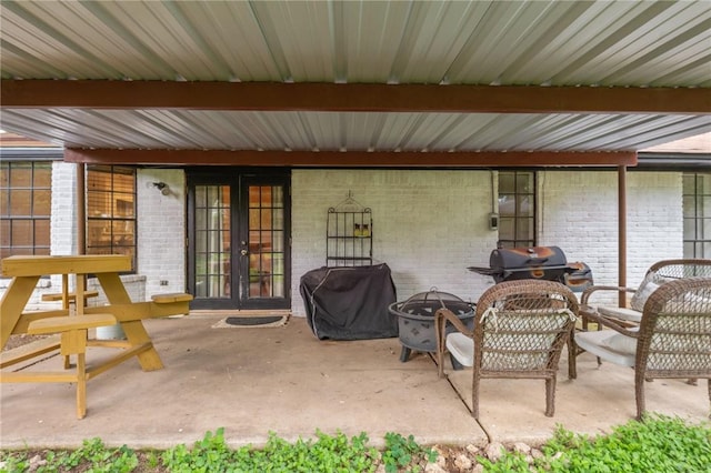 3300 Dallis Dr, College Station, TX 77845 - view of patio / terrace with french doors, grilling area, and an outdoor fire pit