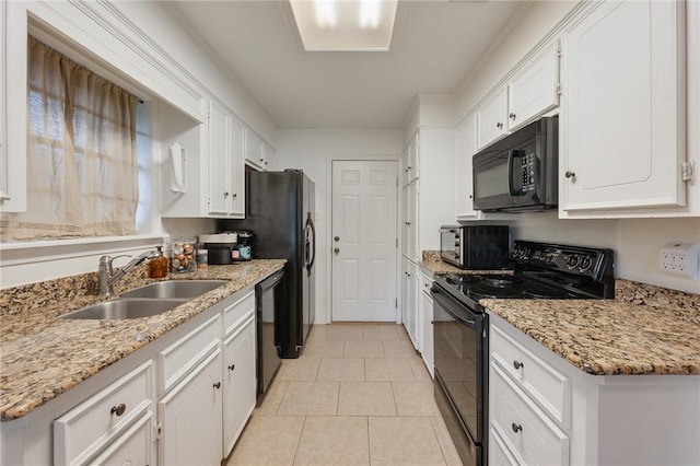 3300 Dallis Dr, College Station, TX 77845 - kitchen featuring black appliances, white cabinets, light tile patterned flooring, and light stone countertops