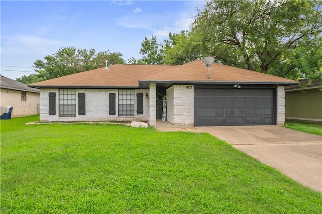 3300 Dallis Dr, College Station, TX 77845 - ranch-style house featuring an attached garage, a front yard, concrete driveway, and brick siding