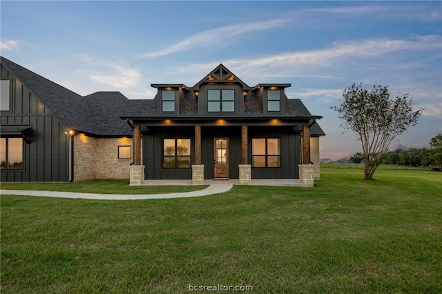 view of front of property with a lawn