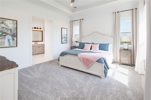 bedroom featuring ensuite bathroom, ceiling fan, crown molding, and multiple windows