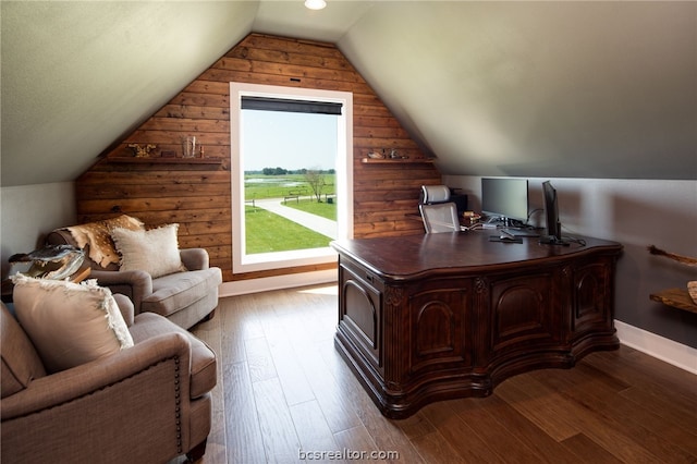 office space featuring hardwood / wood-style floors and vaulted ceiling