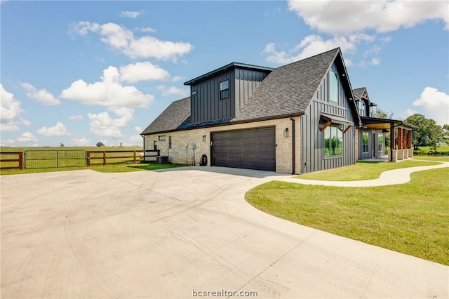 view of property exterior with a yard and a garage