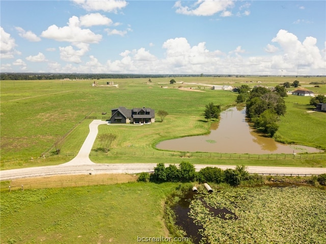 bird's eye view with a rural view and a water view