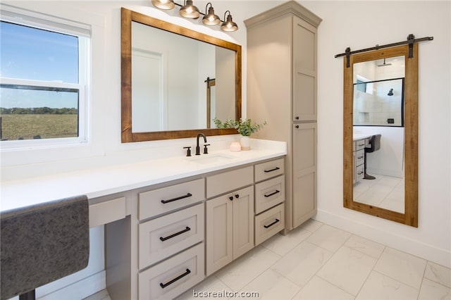 bathroom with vanity and tiled shower