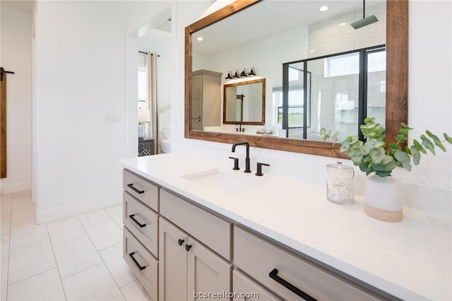 bathroom with vanity and a shower with shower door