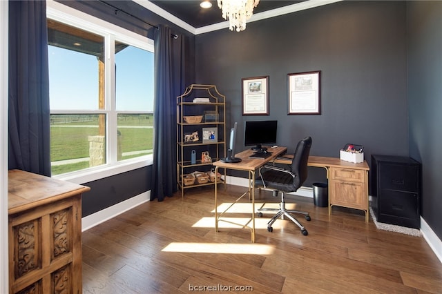 office space with dark hardwood / wood-style floors, ornamental molding, and a chandelier