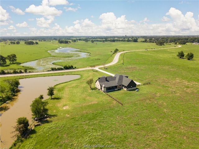 drone / aerial view with a water view and a rural view