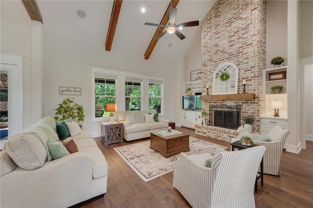 5026 Yellow Tanager Ct, College Station, TX 77845 - living room with a brick fireplace, high vaulted ceiling, ceiling fan, dark wood-style floors, and beamed ceiling