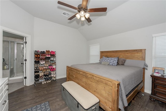 bedroom with connected bathroom, dark hardwood / wood-style floors, vaulted ceiling, and ceiling fan