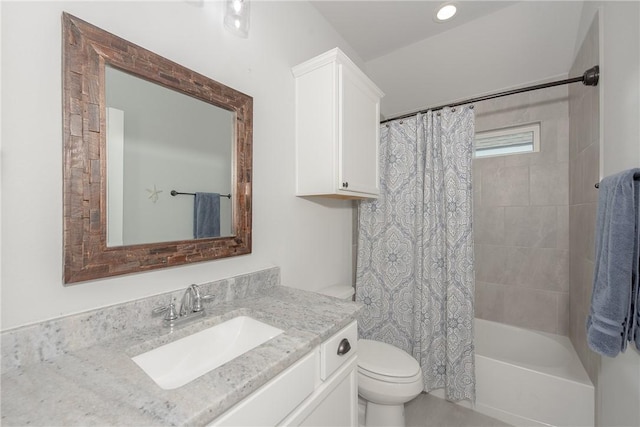 full bathroom with shower / tub combo with curtain, vanity, and toilet