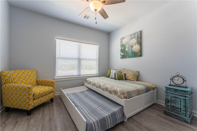 bedroom featuring hardwood / wood-style floors and ceiling fan