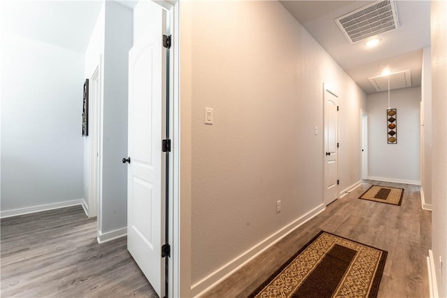 corridor with wood-type flooring