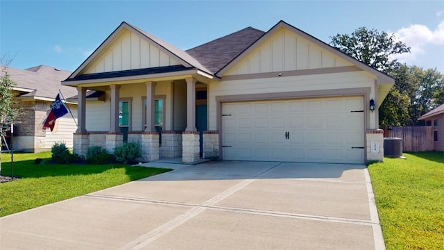 1924 Cartwright St, Bryan, TX 77807 - view of front facade featuring board and batten siding, concrete driveway, a garage, and covered porch