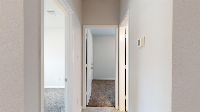 1924 Cartwright St, Bryan, TX 77807 - corridor featuring light carpet and baseboards