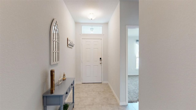 1924 Cartwright St, Bryan, TX 77807 - entrance foyer with light tile patterned floors and baseboards