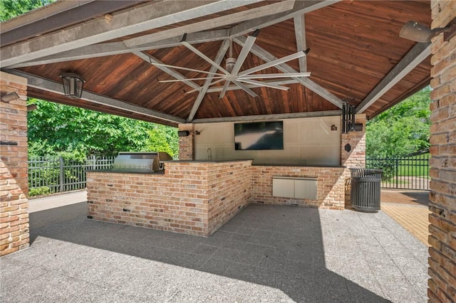 4727 Johnson Creek Loop, College Station, TX 77845 - view of patio / terrace featuring an outdoor kitchen, a gazebo, fence, and ceiling fan