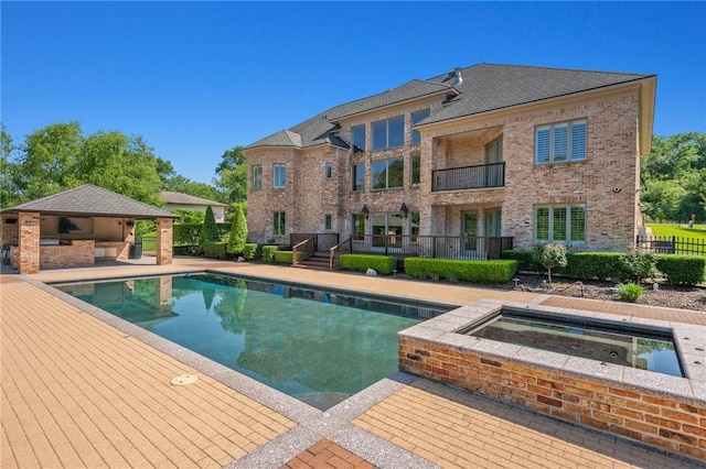 4727 Johnson Creek Loop, College Station, TX 77845 - outdoor pool with a patio area, an in-ground hot tub, and fence