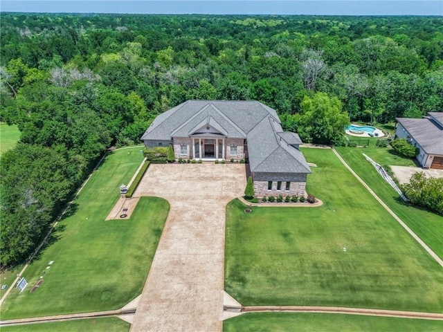 4727 Johnson Creek Loop, College Station, TX 77845 - aerial view of property and surrounding area with a heavily wooded area