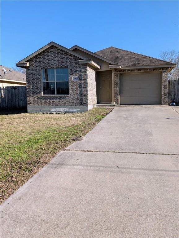 view of front of home with a garage and a front yard