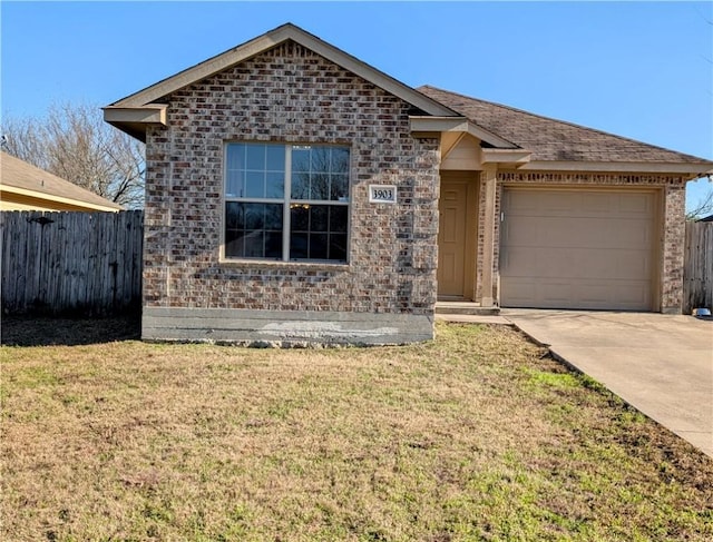 view of front of house with a garage and a front yard