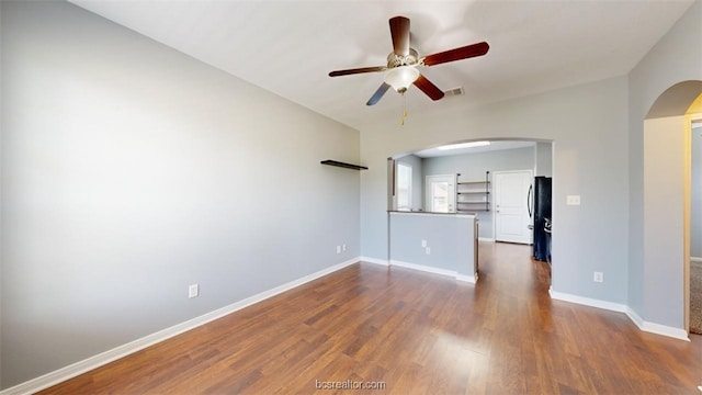 unfurnished room featuring ceiling fan and dark hardwood / wood-style floors