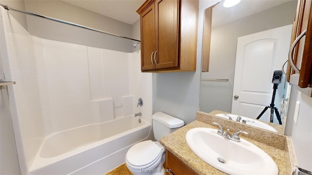 full bathroom with toilet, vanity, and  shower combination