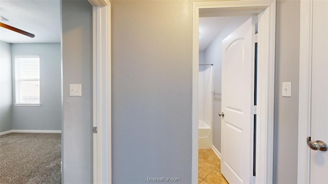 corridor with light colored carpet