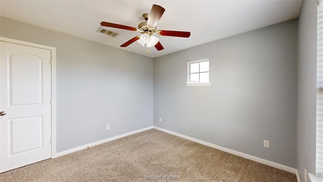 carpeted empty room with ceiling fan